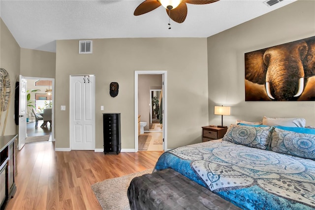 12219 Steppingstone Blvd, Tampa, FL 33635 - bedroom featuring light wood-style flooring, a ceiling fan, ensuite bath, and baseboards