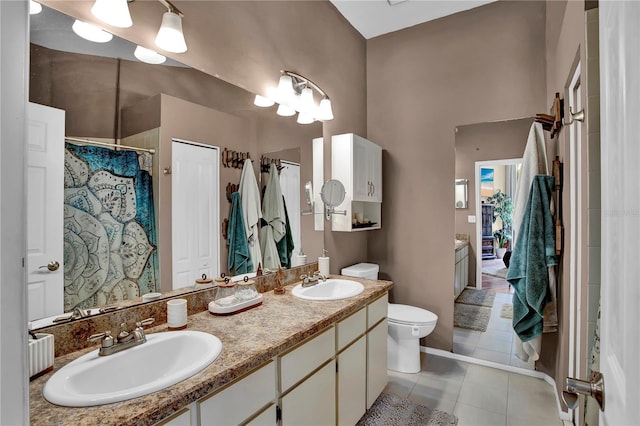 12219 Steppingstone Blvd, Tampa, FL 33635 - bathroom with double vanity, tile patterned flooring, toilet, and curtained shower