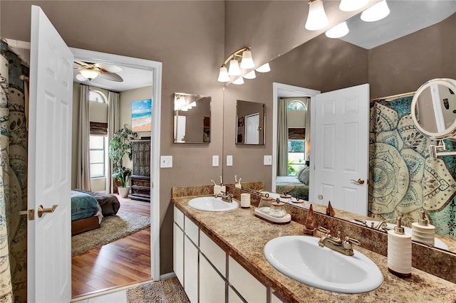 12219 Steppingstone Blvd, Tampa, FL 33635 - ensuite bathroom with plenty of natural light, double vanity, a ceiling fan, and wood finished floors
