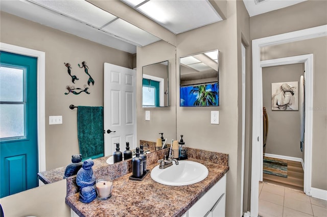 12219 Steppingstone Blvd, Tampa, FL 33635 - bathroom featuring vanity, tile patterned flooring, and baseboards