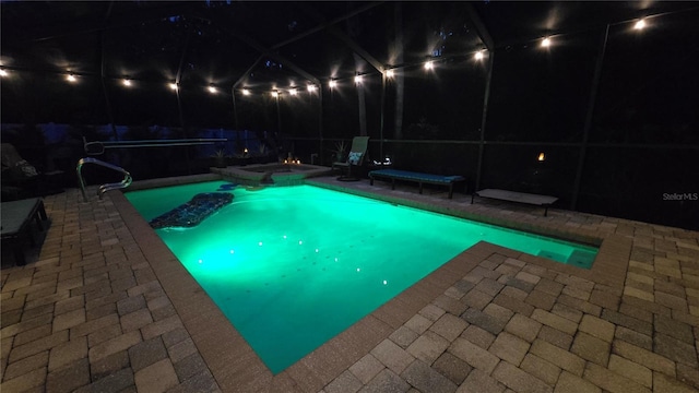 12219 Steppingstone Blvd, Tampa, FL 33635 - pool at twilight featuring a patio area and a pool with connected hot tub