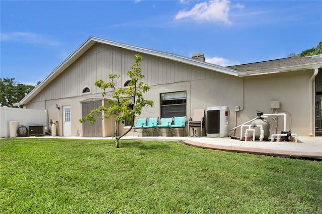 12219 Steppingstone Blvd, Tampa, FL 33635 - rear view of property featuring central AC and stucco siding