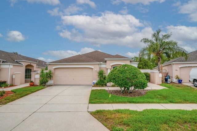 241 Royal Palm Way, Spring Hill, FL 34608 - mediterranean / spanish-style home featuring stucco siding, an attached garage, driveway, and a front yard