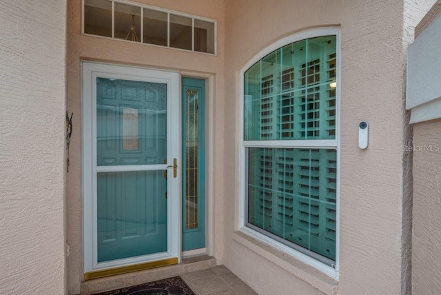 241 Royal Palm Way, Spring Hill, FL 34608 - doorway to property with stucco siding