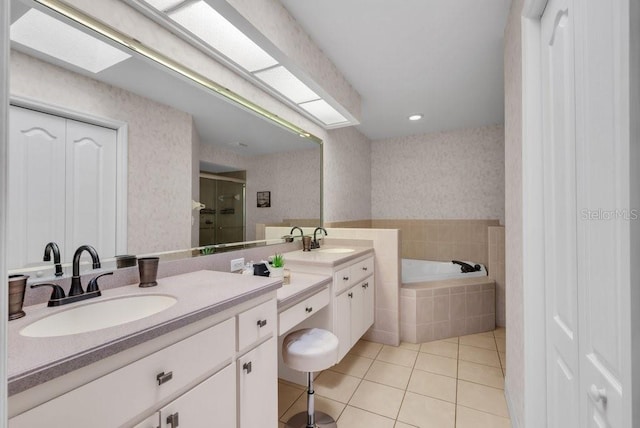 241 Royal Palm Way, Spring Hill, FL 34608 - full bath featuring tile patterned flooring, vanity, a bath, a stall shower, and wallpapered walls