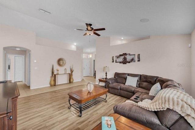 241 Royal Palm Way, Spring Hill, FL 34608 - living area with a ceiling fan, light wood-style floors, arched walkways, and baseboards