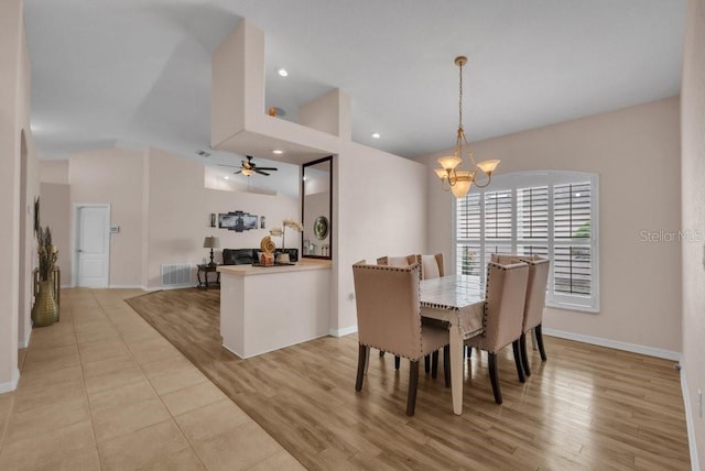 241 Royal Palm Way, Spring Hill, FL 34608 - dining area featuring a chandelier, baseboards, ceiling fan, vaulted ceiling, and light wood finished floors