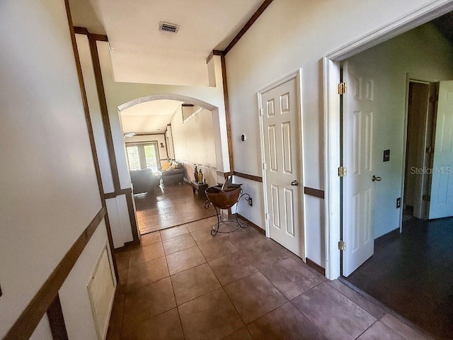 1716 Bondurant Way, Brandon, FL 33511 - hallway featuring arched walkways and dark tile patterned flooring