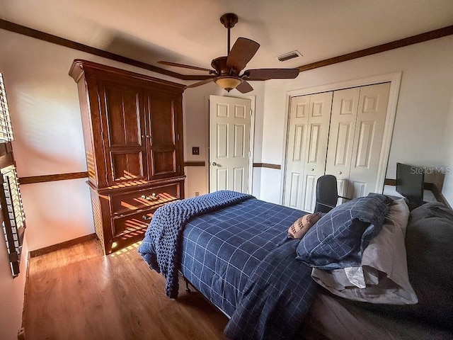 1716 Bondurant Way, Brandon, FL 33511 - bedroom featuring wood finished floors, a closet, ceiling fan, and crown molding