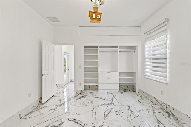 2238 Shirecrest Cove Way, Lutz, FL 33558 - unfurnished bedroom featuring a closet and marble tiled flooring