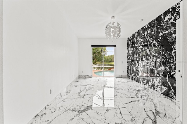 2238 Shirecrest Cove Way, Lutz, FL 33558 - spare room with marble tiled floors and a chandelier