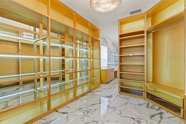 2238 Shirecrest Cove Way, Lutz, FL 33558 - spacious closet with a chandelier and marble tiled floors