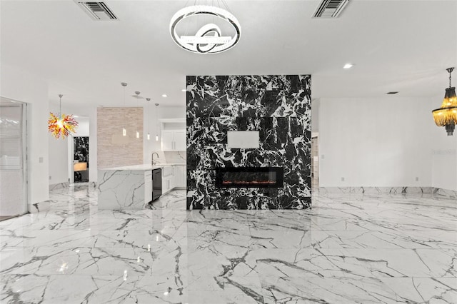 2238 Shirecrest Cove Way, Lutz, FL 33558 - living area featuring a chandelier, recessed lighting, a fireplace, and light marble finish flooring