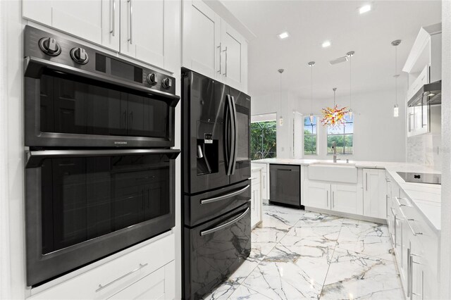 2238 Shirecrest Cove Way, Lutz, FL 33558 - kitchen featuring black appliances, light marble finish floors, a sink, white cabinetry, and decorative light fixtures