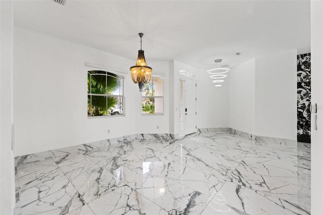 2238 Shirecrest Cove Way, Lutz, FL 33558 - empty room with a chandelier and marble tiled floors