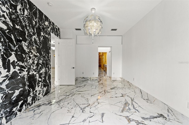 2238 Shirecrest Cove Way, Lutz, FL 33558 - spare room with a chandelier and marble tiled floors