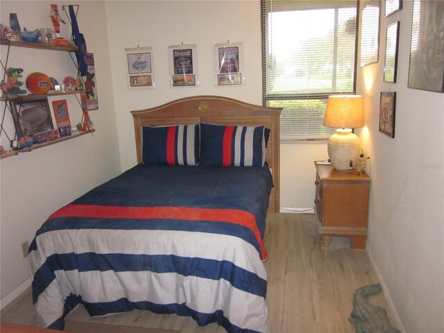 2616 Cove Cay Dr Unit 104, Clearwater, FL 33760 - bedroom with wood finished floors and baseboards