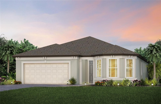 8323 SW 58th Loop, Ocala, FL 34481 - view of front facade featuring a garage, driveway, stucco siding, and a front lawn