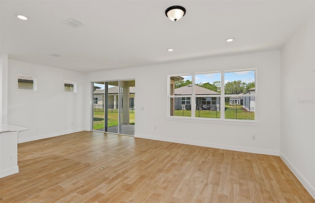 8323 SW 58th Loop, Ocala, FL 34481 - empty room featuring plenty of natural light, light wood finished floors, and recessed lighting