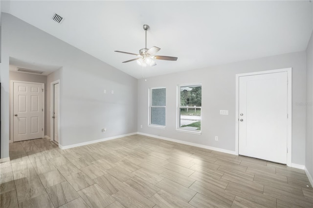 5319 Lantana St, Zephyrhills, FL 33542 - unfurnished room with a ceiling fan, baseboards, lofted ceiling, and light wood finished floors