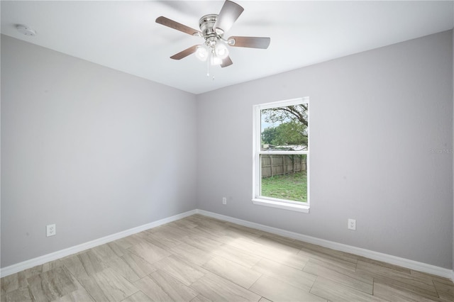 5319 Lantana St, Zephyrhills, FL 33542 - unfurnished room featuring baseboards, ceiling fan, and a smoke detector