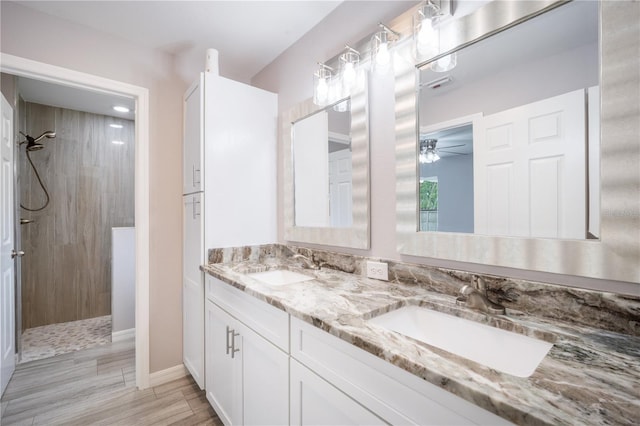 5319 Lantana St, Zephyrhills, FL 33542 - full bath featuring a walk in shower, double vanity, baseboards, and a ceiling fan