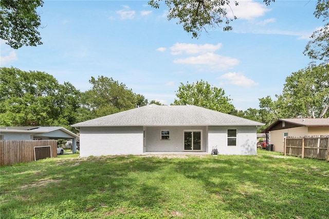 5319 Lantana St, Zephyrhills, FL 33542 - back of property with stucco siding, central air condition unit, and a shingled roof