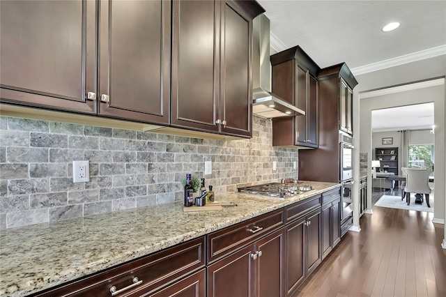 1821 Cherry Walk Rd, Lutz, FL 33558 - kitchen featuring wall chimney range hood, ornamental molding, light stone countertops, stainless steel appliances, and tasteful backsplash