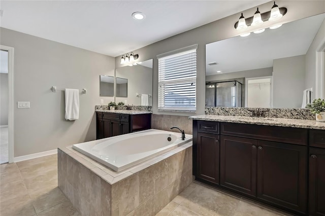 1821 Cherry Walk Rd, Lutz, FL 33558 - full bath featuring a shower stall, a bath, tile patterned floors, and two vanities