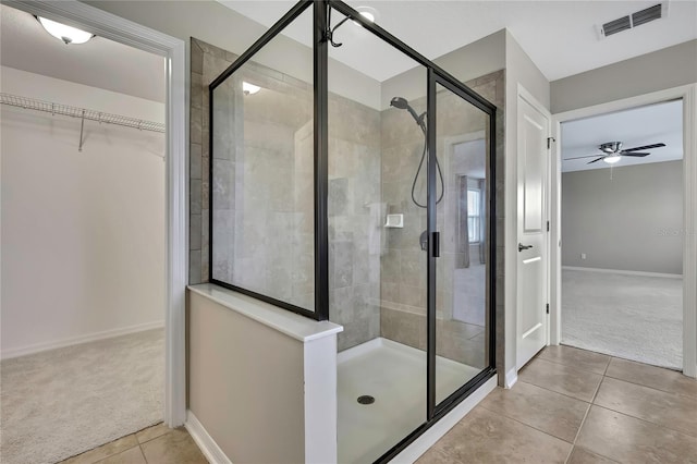 1821 Cherry Walk Rd, Lutz, FL 33558 - full bathroom featuring a shower stall, tile patterned floors, a spacious closet, ceiling fan, and baseboards