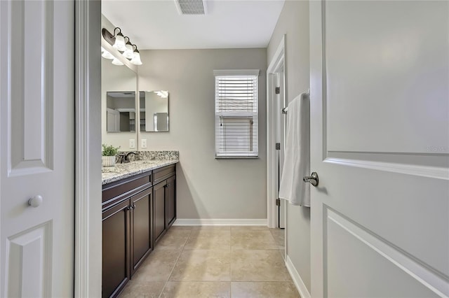 1821 Cherry Walk Rd, Lutz, FL 33558 - bathroom with vanity, tile patterned floors, and baseboards