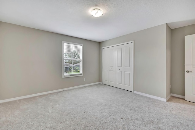 1821 Cherry Walk Rd, Lutz, FL 33558 - unfurnished bedroom featuring light carpet, baseboards, and a closet