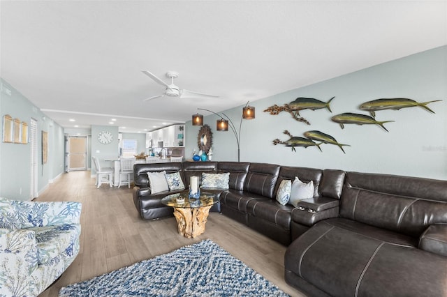 12525 3rd St E Unit 303, Treasure Island, FL 33706 - living area with light wood-type flooring and a ceiling fan