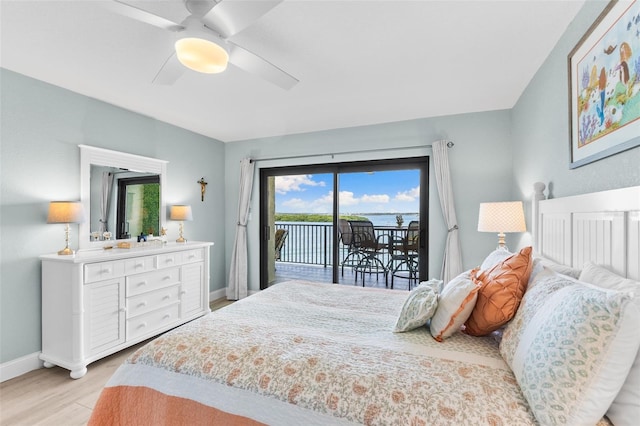 12525 3rd St E Unit 303, Treasure Island, FL 33706 - bedroom with access to outside, light wood finished floors, baseboards, and a ceiling fan