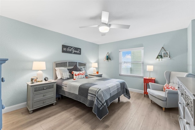 12525 3rd St E Unit 303, Treasure Island, FL 33706 - bedroom featuring light wood-style floors, baseboards, and ceiling fan