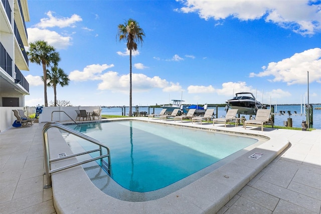 12525 3rd St E Unit 303, Treasure Island, FL 33706 - community pool with a patio area, a water view, and a dock
