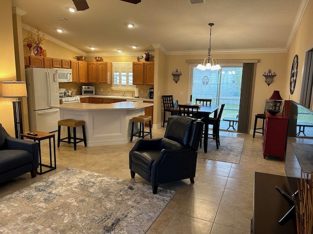 310 Knoll Pl, The Villages, FL 32162 - kitchen featuring white appliances, light countertops, a sink, crown molding, and a chandelier
