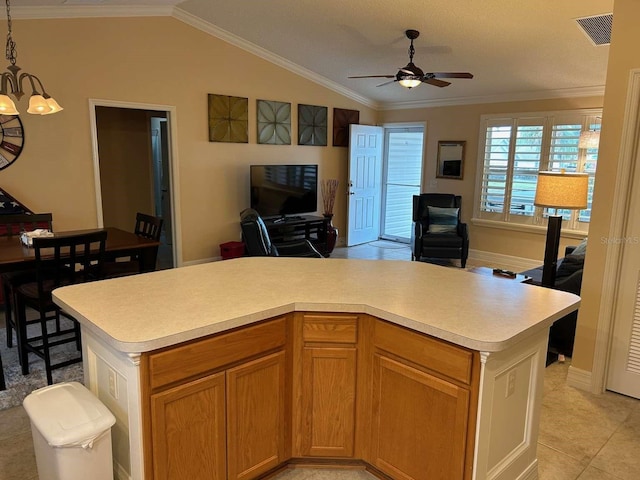 310 Knoll Pl, The Villages, FL 32162 - kitchen with open floor plan, light countertops, ceiling fan, vaulted ceiling, and ornamental molding