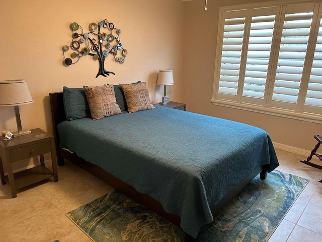 310 Knoll Pl, The Villages, FL 32162 - tiled bedroom with baseboards