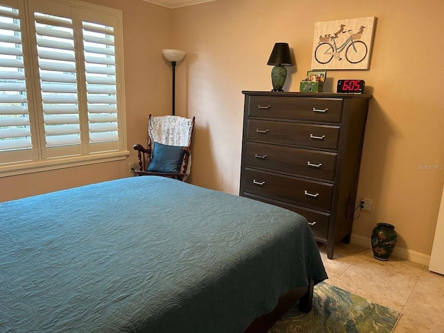 310 Knoll Pl, The Villages, FL 32162 - bedroom with light tile patterned floors, crown molding, and baseboards