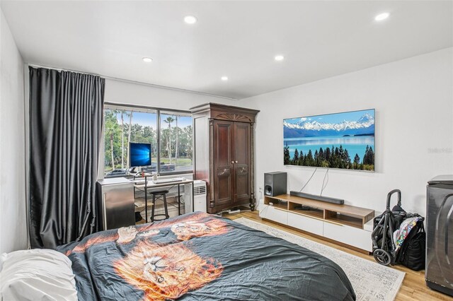 20921 Haulover Cv Unit 8, Lutz, FL 33558 - bedroom with light wood-type flooring and recessed lighting