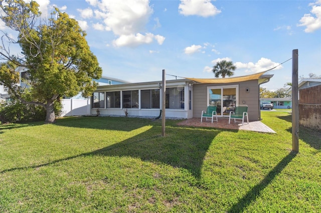 13323 Susan Dr, Hudson, FL 34667 - rear view of house with a sunroom