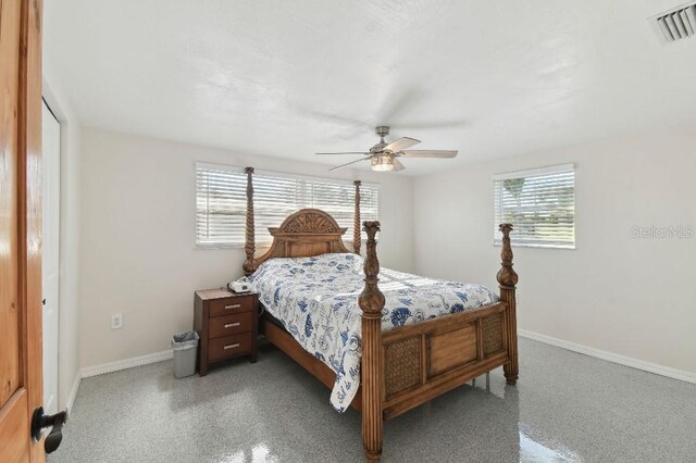 13323 Susan Dr, Hudson, FL 34667 - bedroom featuring multiple windows, baseboards, and ceiling fan