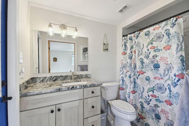 13323 Susan Dr, Hudson, FL 34667 - bathroom featuring vanity, toilet, and a shower with curtain