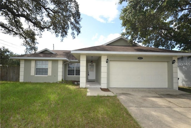 1602 Taylor Lake Cir, Largo, FL 33778 - ranch-style house featuring stucco siding, an attached garage, driveway, and a shingled roof