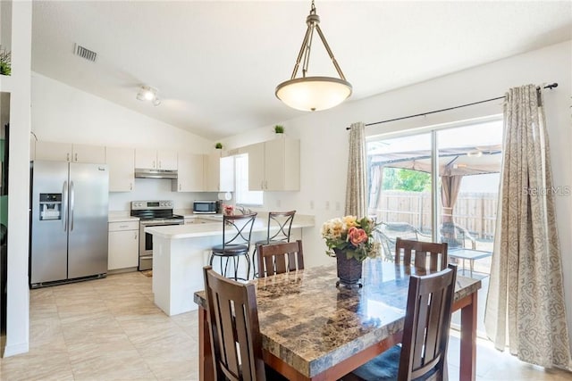 1602 Taylor Lake Cir, Largo, FL 33778 - dining space featuring vaulted ceiling and plenty of natural light