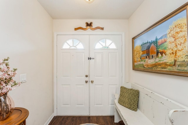 8549 Pinafore Dr, New Port Richey, FL 34653 - entrance foyer featuring dark wood-style floors and baseboards