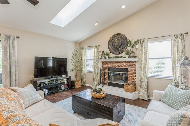 8549 Pinafore Dr, New Port Richey, FL 34653 - living room with vaulted ceiling, a fireplace, baseboards, wood finished floors, and a skylight