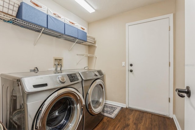 8549 Pinafore Dr, New Port Richey, FL 34653 - laundry area with washer and clothes dryer, wood finished floors, and baseboards