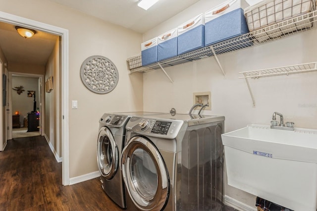 8549 Pinafore Dr, New Port Richey, FL 34653 - washroom featuring washer and dryer, dark wood-style flooring, and baseboards